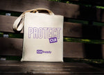 Protect CUI canvas tote bag with purple text on a wooden bench background
