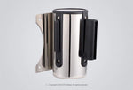 Wall-mounted CUI retractable belt barrier with stainless steel cassette and purple nylon belt for controlled access areas.