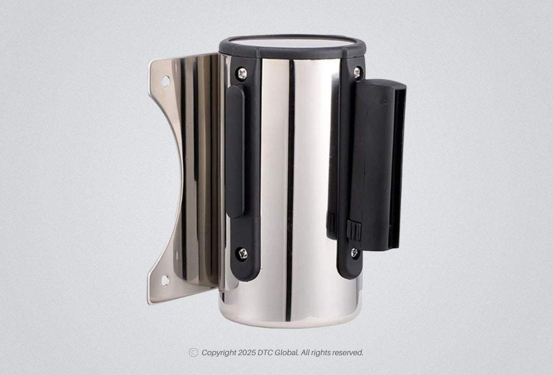 Wall-mounted CUI retractable belt barrier with stainless steel cassette and purple nylon belt for controlled access areas.